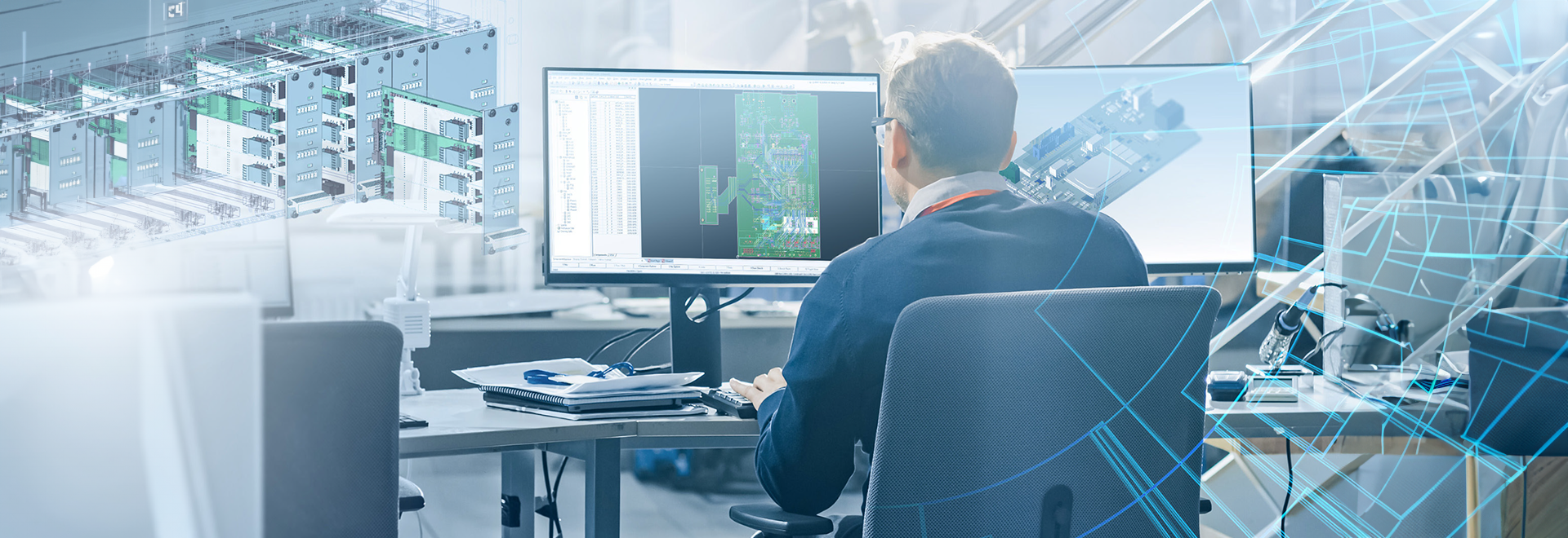 Ingegnere che lavora su un progetto CAD su due monitor in ufficio con sovrapposizione digitale di componenti