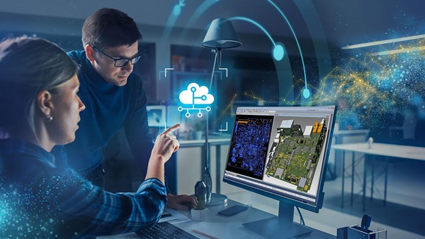 Due ingegneri esaminano progetti di circuiti elettronici sul computer in ufficio