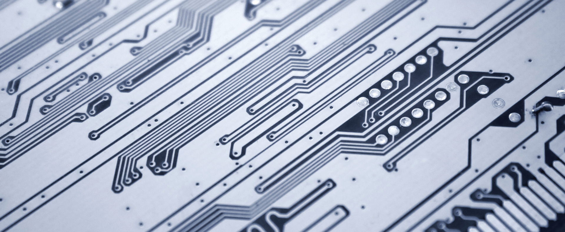 Detail of a printed circuit board with traces and electronic components